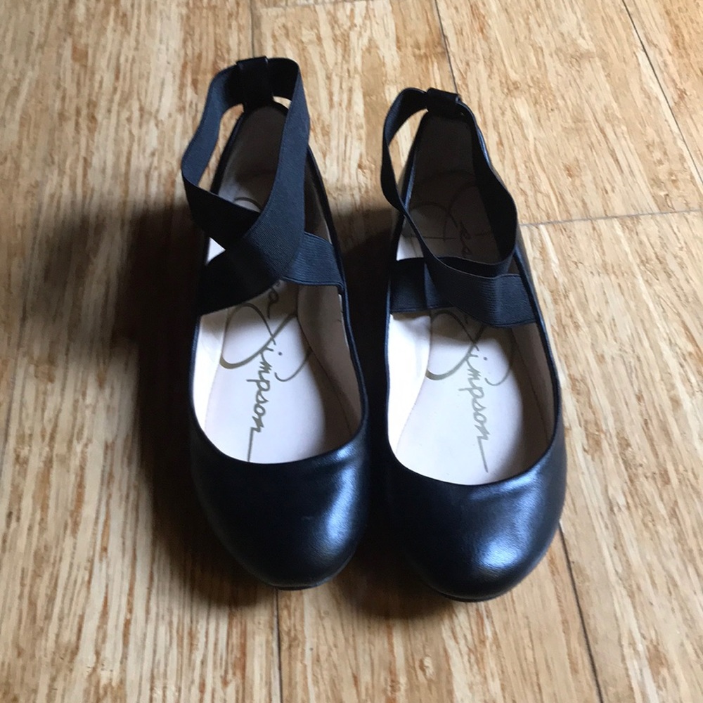 Black cross-cross flats.